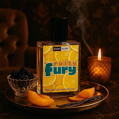 fruity fury perfume bottle placed in a dark room on a table inside a tray with cherries, peaches in upright position facing front in a candle light environment